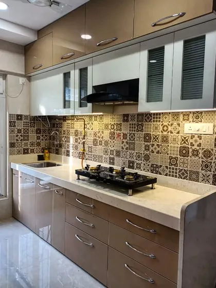 A wider view of the kitchen with Moroccan tiles. We used a combination of open-front and glass-shutter cabinets to balance storage and display.