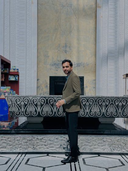 My business casual look for a formal corporate show. I believe in dressing sharp and looking the part, ensuring my style complements the professional atmosphere of your company's event.