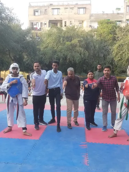 A referee gives instructions before a match at the DDA Hari Nagar championship.