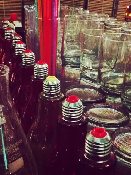 A look at our molecular gastronomy bar setup, featuring drinks served in lab flasks and beakers. This 'Bar Science' theme is one of our most popular and visually striking concepts.
