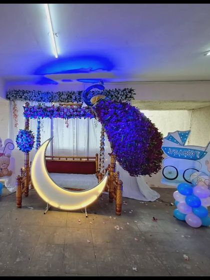 The entire outdoor baby shower setup under blue lighting, creating a cool and modern vibe for the event.