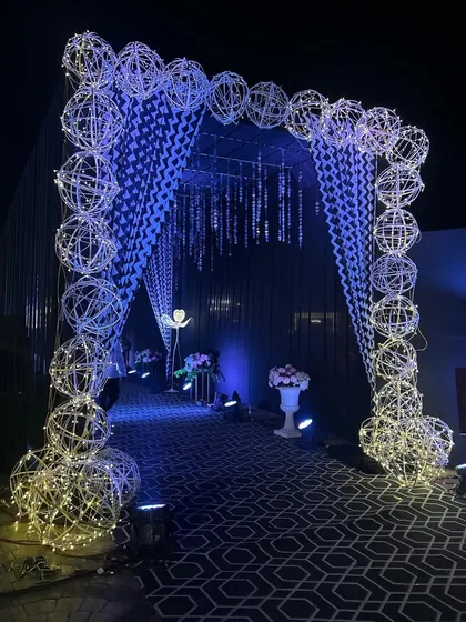 The intricate details of the wire spheres and hanging crystal curtains that made this Sangeet entrance so special.