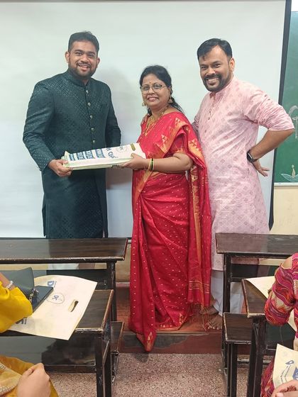 The joy of Diwali at Divesh Classes. Our teachers present a festive gift to a faculty member, celebrating the spirit of the season together.