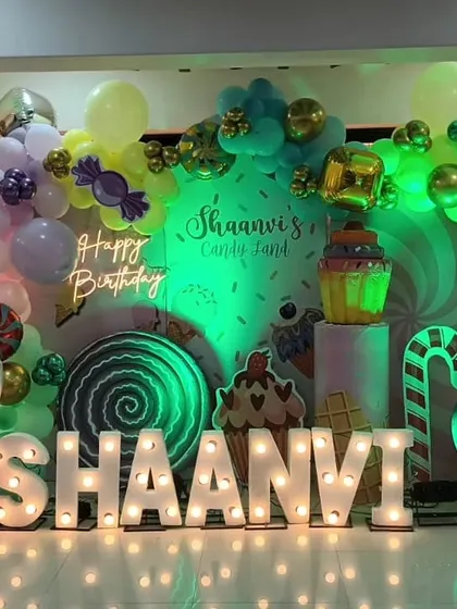 A green-lit variation of the Candyland theme for Shaanvi's birthday, showing how we use colored lighting to change the mood of the setup.