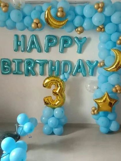 A clear view of the blue and gold 3rd birthday home decoration.