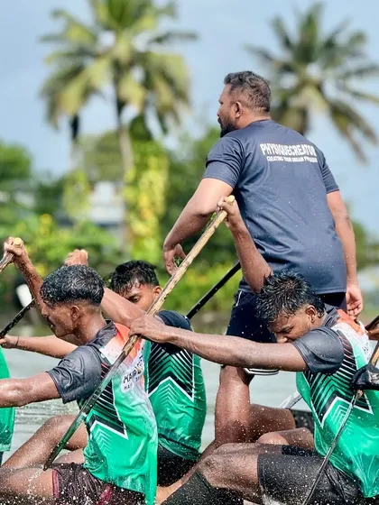 Close-up during a training run, observing the athletes' form. I focus on individual biomechanics within the team structure to ensure each athlete is contributing effectively and safely.