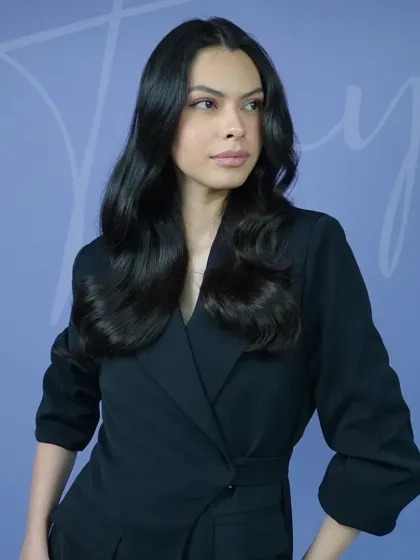 The movement and flow of a professional blowout are unmatched. Here, you can see how the soft waves fall gracefully, framing the face and adding a touch of glamour. This look was achieved using Label.M products for protection, hold, and shine.