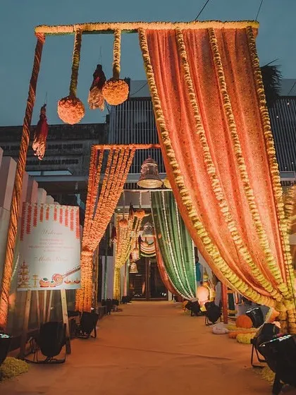 The entrance to the Mata ki Chowki, draped in vibrant orange fabrics and adorned with marigold balls and traditional bells. This created a warm and auspicious welcome for the evening of prayer and bhajans.