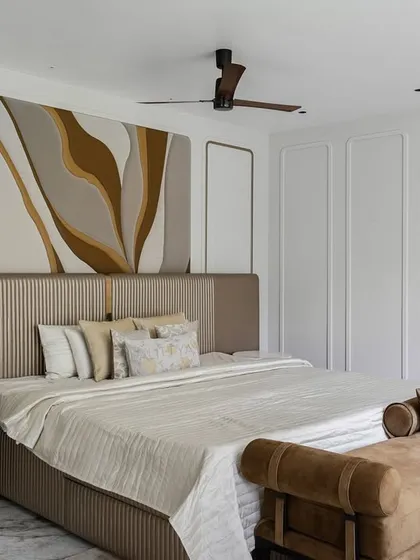 The bed in this kid's room features a unique upholstered headboard and a custom art piece above it, creating a sophisticated yet personal focal point. The neutral color palette is designed to be timeless.