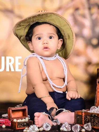 A little treasure hunter surrounded by jewels and a globe, with the text "Finally Found the Treasure."
