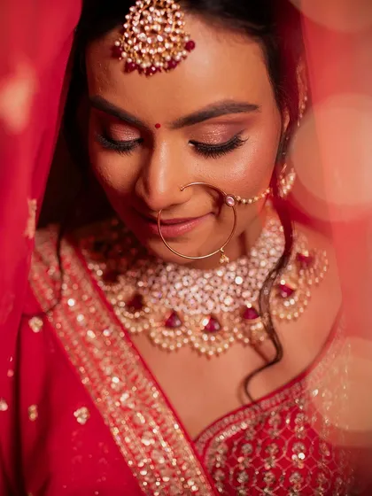 Portraits of my bride Sameera. I created a beautiful look that complemented her dusky skin tone and classic red lehenga.