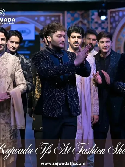 Another shot of the models on the runway, celebrating the successful showcase of our latest collection. The variety of designs highlights the breadth of our creative vision.