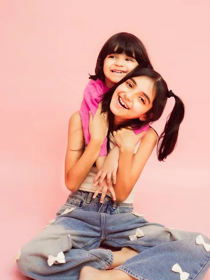 A sweet and simple portrait of two sisters. Their connection is the focus of this beautiful shot.