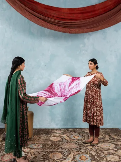 Two models showcasing different prints and styles from the 'Folksong' collection. This demonstrates my ability to style multiple looks that are cohesive yet individually distinct within a single campaign.