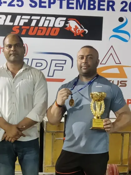 With my gold medal and Strong Man trophy from the Senior Delhi State equipped powerlifting competition.