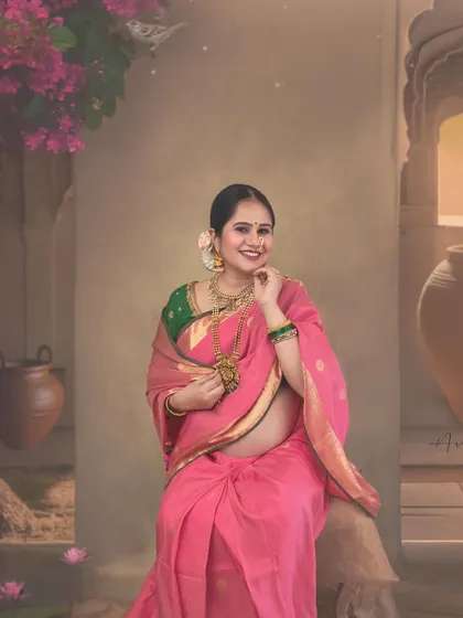 This full-length portrait showcases the entire artistic setup, from the painted backdrop to the floral details. It demonstrates how I create a unique, story-telling environment for each client's cultural maternity session.