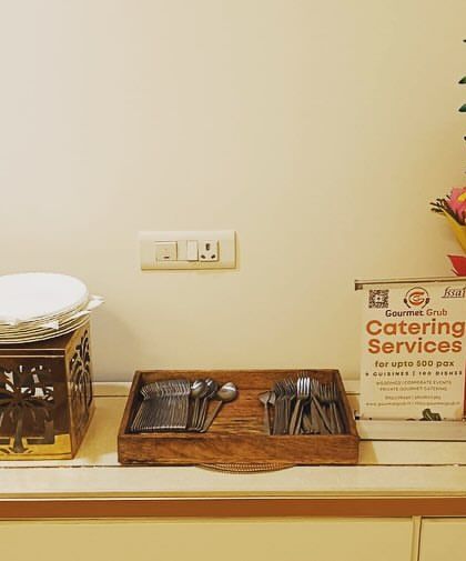 A compact setup for 40 guests in Sector 31, Gurgaon. This image shows my catering services sign and a beautiful fruit bouquet, which can be a lovely addition to any event.