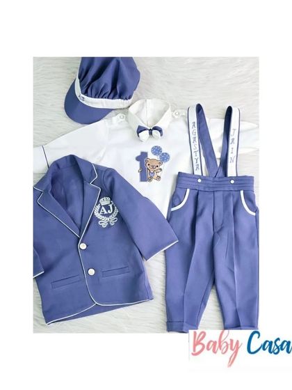 Another look at our custom birthday sets for boys. This one features a blue blazer with an embroidered crest and a personalized romper, perfect for a 'prince' theme.
