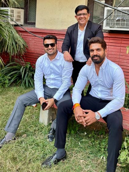 A relaxed moment with colleagues in the court's green spaces.