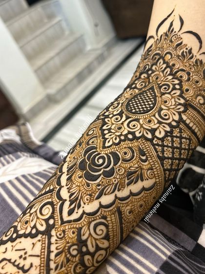 Another angle of Afreen's forearm, showcasing the intricate details and bold lines.