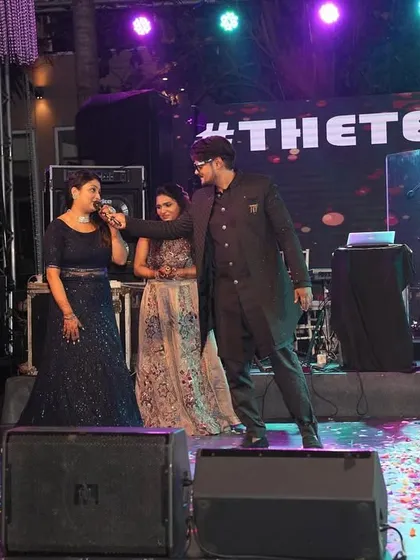 On stage during a Sangeet in Goa, engaging with the bride's family. I make it a point to involve key family members in the fun, creating special moments for them.