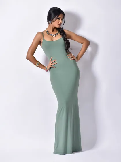 A classic, confident pose that showcases the entire look, from the silhouette of the dress to the placement of the Curiocottage jewellery.