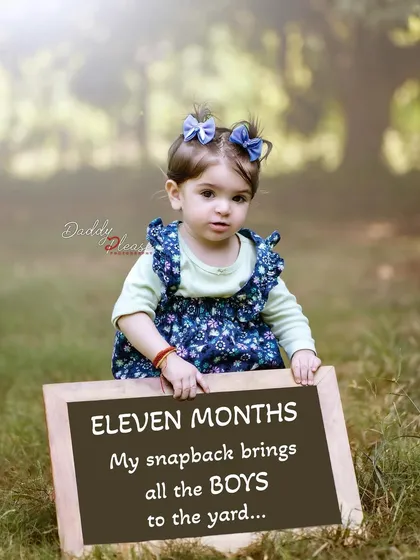 A cute pre birthday shoot for an eleven month old girl, featuring a chalkboard with a funny quote. These monthly milestone photos are a great way to lead up to the first birthday.
