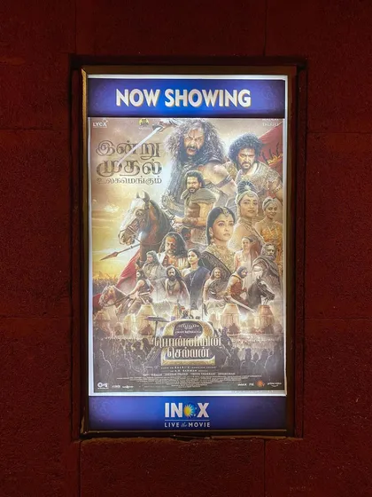 The official movie poster for 'Ponniyin Selvan 2' displayed at the cinema. A proud moment to see our collective work being shared with the world.