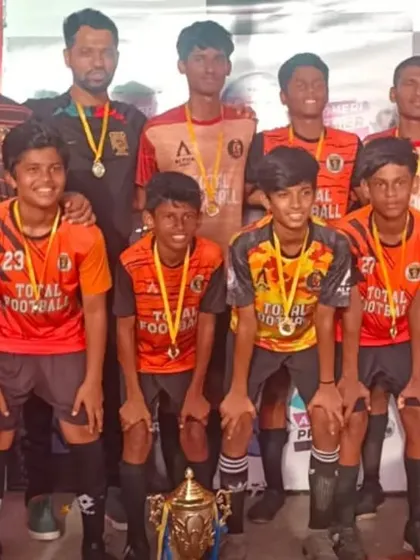 Our U15 team, champions of the Andheri Premier League, showcasing their medals and trophy.