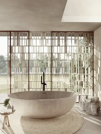 For our Pavilion Homes, the design is oriented towards the serene landscape. This bathroom features a monolithic concrete tub and expansive glass walls, with a delicate screen providing privacy while allowing residents to feel immersed in the tranquility of the adjoining paddy fields.