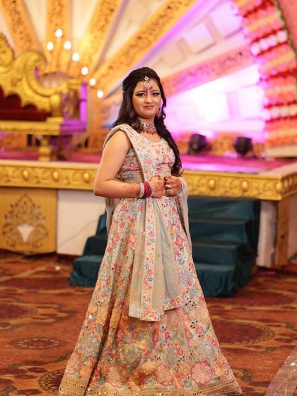 This client looks beautiful in the multi-color floral lehenga, perfect for a destination wedding or a vibrant mehendi party.