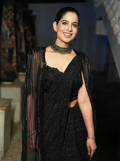 A full look at my black saree for the Encalm gala. I believe in dressing to match the theme and elegance of the event.