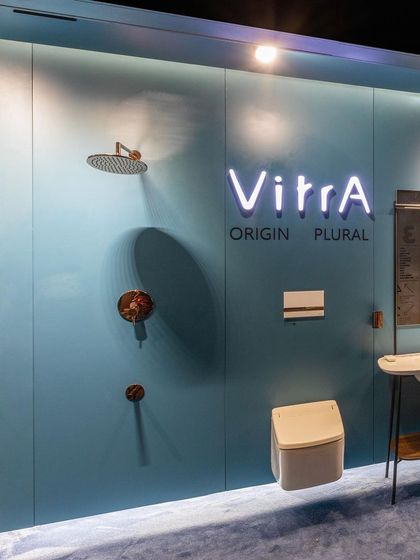 The "Vitra Origin Plural" display uses neon signage and carefully placed products to highlight a specific collection. This is an example of how I integrate branding directly into the architectural features of a retail space.