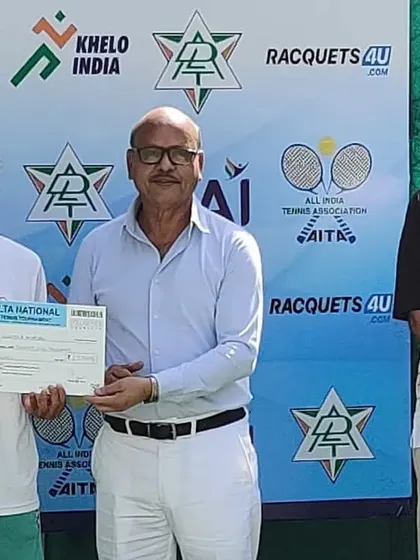 A female champion receives her trophy at the DLTA Nationals.
