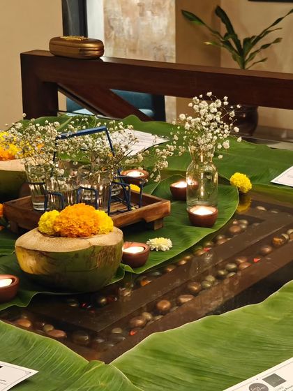Another shot of the elegant table setup for a private dining event. The combination of candlelight, fresh flowers, and traditional decor creates a magical ambiance.