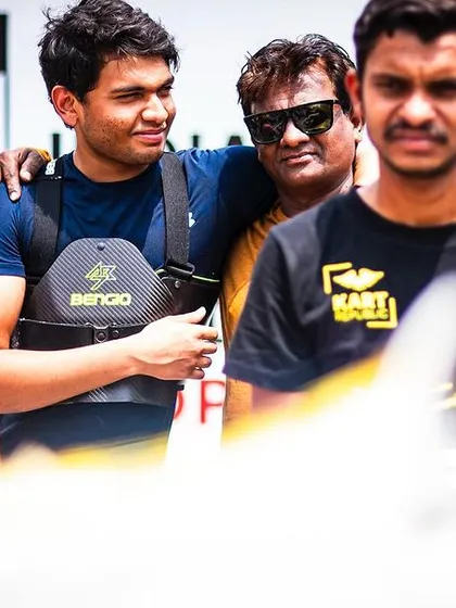 A candid moment in the paddock with our drivers and team.
