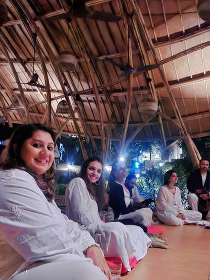 A full moon kirtan session under a beautiful bamboo structure. The energy of the full moon is perfect for reflection, chanting, and connecting with the community.