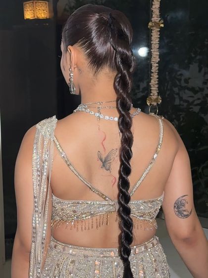 The beauty of a twisted braid is in its clean lines and glossy finish. This rear view shows the perfect symmetry and hold we achieve.