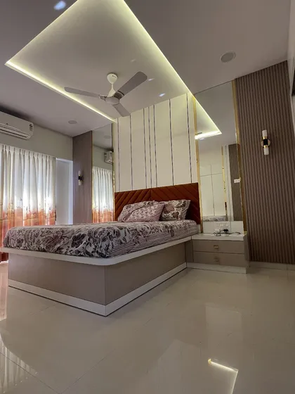 Your bedroom should be your ultimate retreat. In this space, I used a blend of soft lighting, luxurious textures, and clever mirror placements to create an ambiance of serene sophistication. The result is a peaceful haven for rest and rejuvenation.