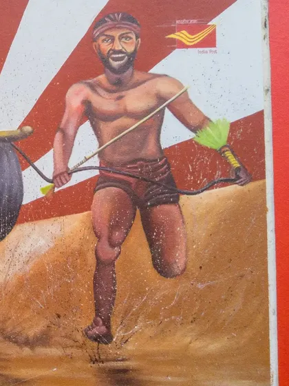 Detail of the Kambala jockey, showcasing the athletic form and determination central to the sport. This piece was part of a collaboration with the Department of Posts India in Mangalore.
