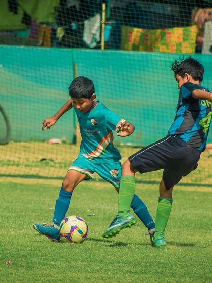 A player tackles an opponent to win back possession for his team.