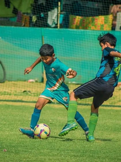A player tackles an opponent to win back possession for his team.