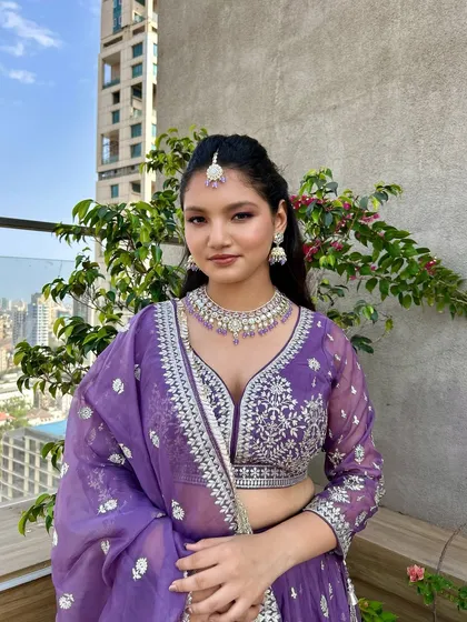 A perfect example of my signature soft glam. This look features a clean, radiant base with a gentle pop of purple on the eyes and cheeks, ideal for when you want to look polished without feeling overdone.