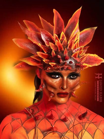 Another portrait of the fire-elemental look, showcasing the intense color and detailed texture work. This level of artistry is what we inspire our students to achieve.