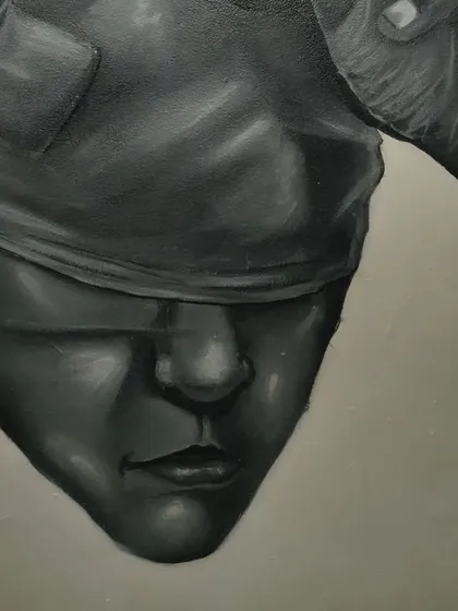 Detail of the third face from the mural. The blindfolded look was created with careful shading to suggest form and texture.