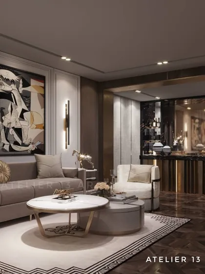 A formal living area designed around a large, vibrant art piece reminiscent of Picasso. The space includes a sophisticated bar in the background, demonstrating our ability to integrate art and entertainment into a cohesive luxury design.