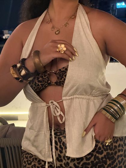 A close-up on the accessories for the animal print outfit. I stacked a bunch of thrifted and new bangles and rings to add to the maximalist feel. More is more!