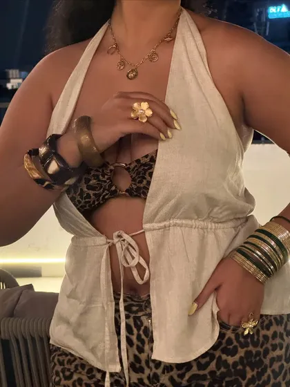 A close-up on the accessories for the animal print outfit. I stacked a bunch of thrifted and new bangles and rings to add to the maximalist feel. More is more!