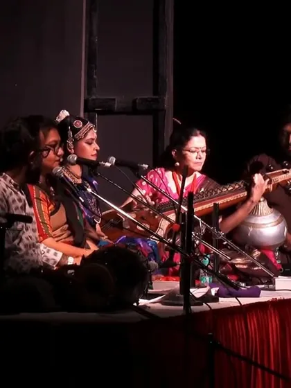 Here you can see me practicing Nattuvangam, the art of rhythmically conducting a dance performance using cymbals. This was a special moment for me, as I was doing Nattuvangam for my own Guru's performance. I also offer specialized workshops in Nattuvangam and Konnakol for advanced students.