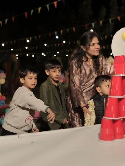 Kids enjoying a classic cup stacking carnival game. I can arrange a variety of game booths to suit your theme.